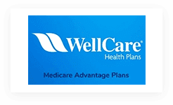 A blue sign with the words " wellcare health plans medicare advantage plans ".